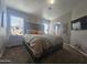 Spacious bedroom with plush bed, large TV, and ample closet space at 650 N Hawes Rd # 2709, Mesa, AZ 85207