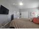 Bright bedroom with a comfy bed, large TV and double door closet at 650 N Hawes Rd # 2709, Mesa, AZ 85207