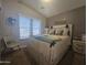 Comfortable bedroom with a queen-size bed and window at 650 N Hawes Rd # 2709, Mesa, AZ 85207