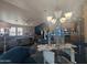Elegant dining area with chandelier and view into the living room and kitchen at 650 N Hawes Rd # 2709, Mesa, AZ 85207