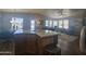 Open kitchen with island, stainless steel appliances, and wood cabinets at 650 N Hawes Rd # 2709, Mesa, AZ 85207