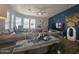Spacious living room with sectional sofa, large TV, and decorative wall at 650 N Hawes Rd # 2709, Mesa, AZ 85207