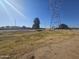 Open grassy field next to a powerline at 650 N Hawes Rd # 2709, Mesa, AZ 85207
