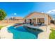 Stunning kidney-shaped pool in a backyard oasis at 7248 W Surrey Ave, Peoria, AZ 85381