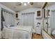 Bright bedroom with a queen bed and mirrored closet at 7750 E Broadway Rd # 309, Mesa, AZ 85208