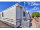 View of the home's exterior and central AC unit at 7750 E Broadway Rd # 309, Mesa, AZ 85208