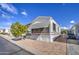 Mobile home with covered awning, a tree, and paved driveway at 7750 E Broadway Rd # 309, Mesa, AZ 85208