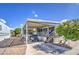 Mobile home with covered patio, golf cart, and brick paver driveway at 7750 E Broadway Rd # 309, Mesa, AZ 85208