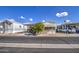Mobile home with covered parking, a tree, and adjacent homes visible at 7750 E Broadway Rd # 309, Mesa, AZ 85208