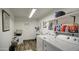 Laundry room with washer, dryer, shelving, and a utility sink at 7750 E Broadway Rd # 309, Mesa, AZ 85208