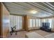 Bright living room featuring a large window and a flat-screen TV at 7750 E Broadway Rd # 309, Mesa, AZ 85208