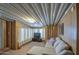 Relaxing living room with sectional sofa and wood paneling at 7750 E Broadway Rd # 309, Mesa, AZ 85208