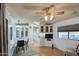 Open concept living and dining space with a kitchen and tv at 7750 E Broadway Rd # 309, Mesa, AZ 85208