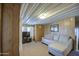 Relaxing living room with sectional sofa and wood paneling at 7750 E Broadway Rd # 309, Mesa, AZ 85208
