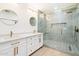 Elegant bathroom with double vanity, marble countertops, and a large glass shower at 7955 E Chaparral Rd # 116, Scottsdale, AZ 85250