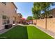 Artificial turf backyard with patio furniture and seating area at 8454 E Keats Ave, Mesa, AZ 85209