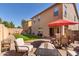 Backyard oasis with patio furniture, artificial turf, and playset at 8454 E Keats Ave, Mesa, AZ 85209
