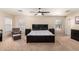 Spacious bedroom with large bed, ceiling fan, and ample closet space at 8454 E Keats Ave, Mesa, AZ 85209