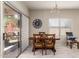 Bright dining area with wood table and access to backyard at 8454 E Keats Ave, Mesa, AZ 85209