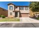 Two-story house with a two-car garage and well-maintained landscaping at 8454 E Keats Ave, Mesa, AZ 85209