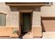 Inviting front entrance with a green door and landscaping at 8454 E Keats Ave, Mesa, AZ 85209