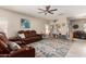 Spacious living room with leather furniture and tile floors at 8454 E Keats Ave, Mesa, AZ 85209