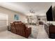 Spacious living room with leather furniture and tile floors at 8454 E Keats Ave, Mesa, AZ 85209