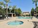 Community pool and spa with lounge chairs and covered patio at 8454 E Keats Ave, Mesa, AZ 85209