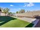 Artificial turf, patio, and playset in backyard at 9038 W Orchid Ln, Peoria, AZ 85345