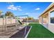 Backyard with playset and grassy area at 9038 W Orchid Ln, Peoria, AZ 85345