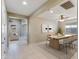 Modern dining area with a table and chairs, overlooking the living room at 9038 W Orchid Ln, Peoria, AZ 85345