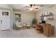 Bright home office featuring a desk, chairs, and built-in shelves at 9038 W Orchid Ln, Peoria, AZ 85345