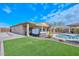 Large backyard oasis with pool, spa, and putting green at 9911 W Jessie Ln, Peoria, AZ 85383