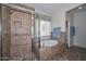 Bathroom features a shower, soaking tub, and tile flooring at 9911 W Jessie Ln, Peoria, AZ 85383