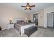 Main bedroom with comfy bed and ensuite bathroom at 9911 W Jessie Ln, Peoria, AZ 85383