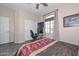 Bedroom with home office setup and large window at 9911 W Jessie Ln, Peoria, AZ 85383