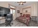 Bedroom with built-in murphy bed and home office at 9911 W Jessie Ln, Peoria, AZ 85383