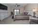 Bright bedroom with large TV and backyard access at 9911 W Jessie Ln, Peoria, AZ 85383