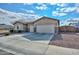 House exterior with a two-car garage and gated entryway at 9911 W Jessie Ln, Peoria, AZ 85383