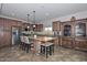 Open kitchen with large island and butcher block countertop at 9911 W Jessie Ln, Peoria, AZ 85383