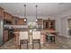 Kitchen with granite countertops and a breakfast bar at 9911 W Jessie Ln, Peoria, AZ 85383