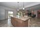 Open kitchen with breakfast bar and views to Gathering room at 9911 W Jessie Ln, Peoria, AZ 85383