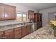 Kitchen features granite counters and stainless steel appliances at 9911 W Jessie Ln, Peoria, AZ 85383