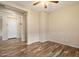 Living room features hard wood floors, neutral wall paint and is bathed in natural light at 9911 W Jessie Ln, Peoria, AZ 85383
