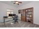 Home office with built-in bookcases and desk at 9911 W Jessie Ln, Peoria, AZ 85383