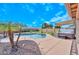 Inviting kidney-shaped pool with a spa and spacious patio at 9911 W Jessie Ln, Peoria, AZ 85383