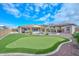 Artificial putting green in backyard with pool and spa at 9911 W Jessie Ln, Peoria, AZ 85383