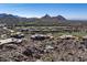 Aerial view of community with pool, golf course, and mountain views at 10222 E Southwind Ln # 1066, Scottsdale, AZ 85262