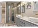 Modern bathroom with double sinks, marble countertop, and walk-in shower at 10222 E Southwind Ln # 1066, Scottsdale, AZ 85262