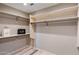 Large walk-in closet with ample shelving and hanging space at 10222 E Southwind Ln # 1066, Scottsdale, AZ 85262